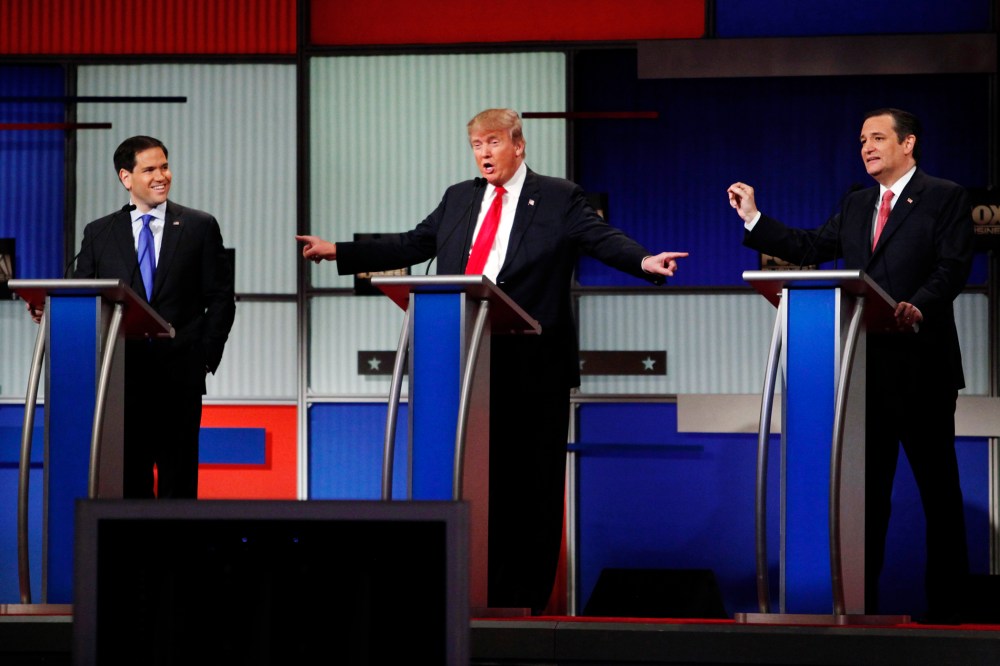 Presidential candidate Donald Trump gestures towards rivals Senator Marco Rubio and Senator Ted Cruz during the sixth Republican presidential candidates debate in North Charleston, S.C., Jan. 14, 2016. (Photo by Randall Hill/Reuters)