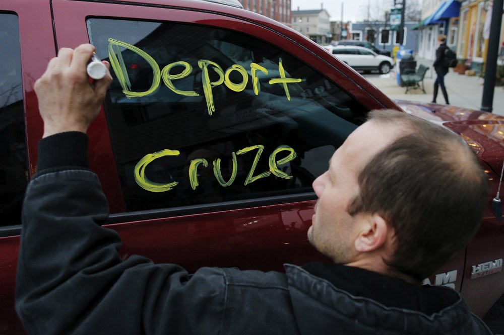 A man writes a message on his own truck's window outside a campaign stop by Republican presidential candidate and Senator Ted Cruz in Milford, N.H., Jan. 17, 2016. (Photo by Brian Snyder/Reuters)