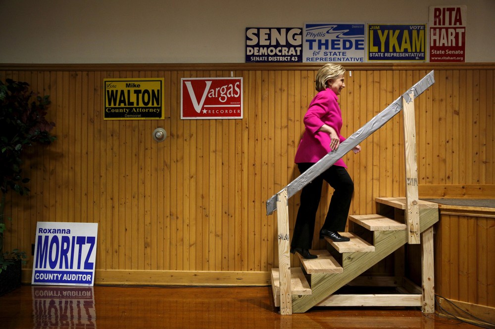Democratic U.S. presidential candidate Hillary Clinton takes the stage to speak during the Scott County Democratic Party's Red, White and Blue Dinner at the Mississippi Valley Fairgrounds in Davenport, Ia., Jan. 23, 2016. (Photo by Scott Morgan/Reuters)