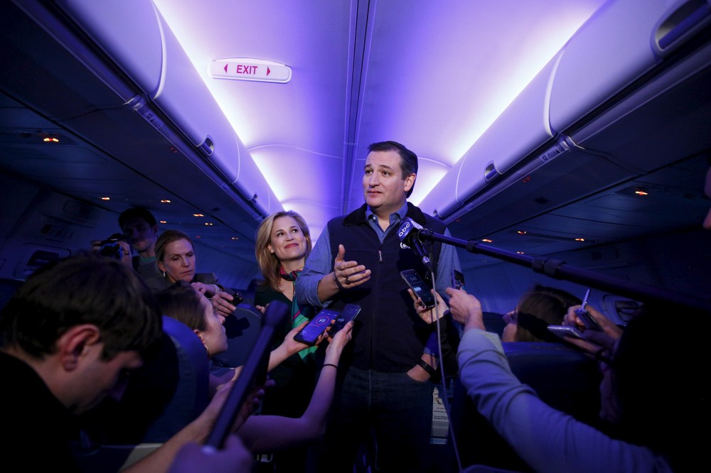 U.S. Republican presidential candidate Ted Cruz and his wife Heidi speak to the press aboard a plane en route to a campaign event in Piedmont, S.C., Feb. 2, 2016. (Photo by Eric Thayer/Reuters)