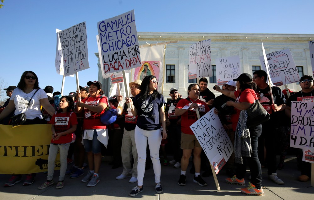 Immigration activists rally outside the U.S. Supreme Court as justices hear arguments on immigration in Washington April 18, 2016. (Photo by Joshua Roberts/Reuters)