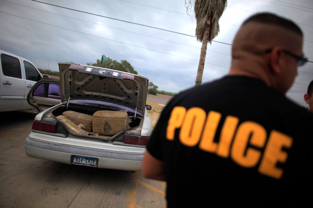 A car filled with bales of marijuana is seen at a police station in La Grulla, Texas