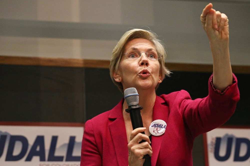 U.S. Sen. Elizabeth Warren speaks to a crowd during a rally to urge the reelection of Colo. Sen. Mark Udall to the Senate in Boulder, Colo. on Oct. 17, 2014. (Brennan Linsley/AP)