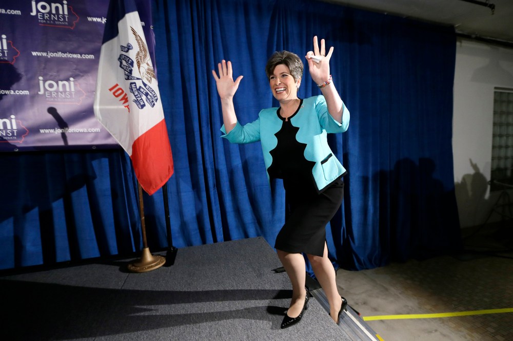 State Sen. Joni Ernst waves to supporters at a primary election night rally in Des Moines, Iowa, June 3, 2014.