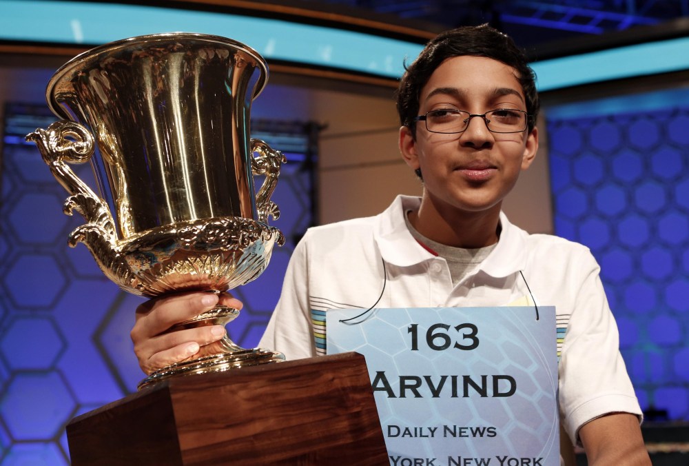 Arvind Mahankali of New York holds his trophy after winning the Scripps National Spelling Bee May 30, 2013. Mahankali, a 13-year-old from Bayside Hills, New York, won the Scripps National Spelling Bee on Thursday. REUTERS/Kevin Lamarque  (UNITED STATES