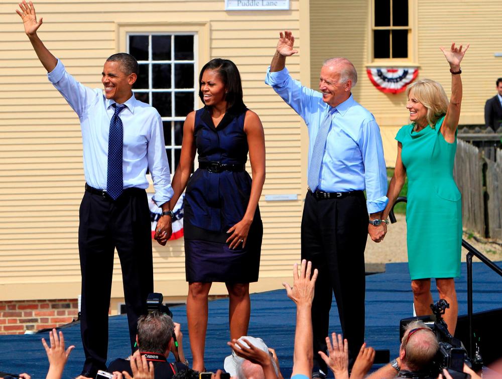 From left, President Barack Obama, first lady Michelle Obama, Vice President Joe Biden and Dr. Jill Biden wave to thousands at a campaign stop, Friday, Sept. 7, 2012, in Portsmouth, N.H.