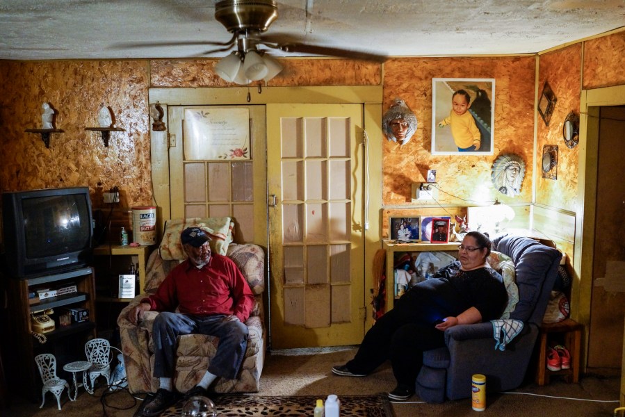 Thomas Blakely’s father Nate and mother Wilanda at home in Idabel. Thomas’s mother says that since Thomas began visiting with an outreach worker, his behavior and attitude have gotten better. Both parents worry though that Thomas will never make it out of