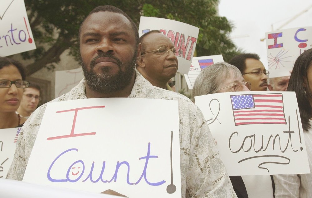 File Photo: Felon Leroy Jones joins other demonstrators outside court in Miami, Wednesday, April 9, 2003, where the 11th U.S. Circuit Court of Appeals heard arguments on whether the state is doing enough to help ex-felons restore their voting rights. ...