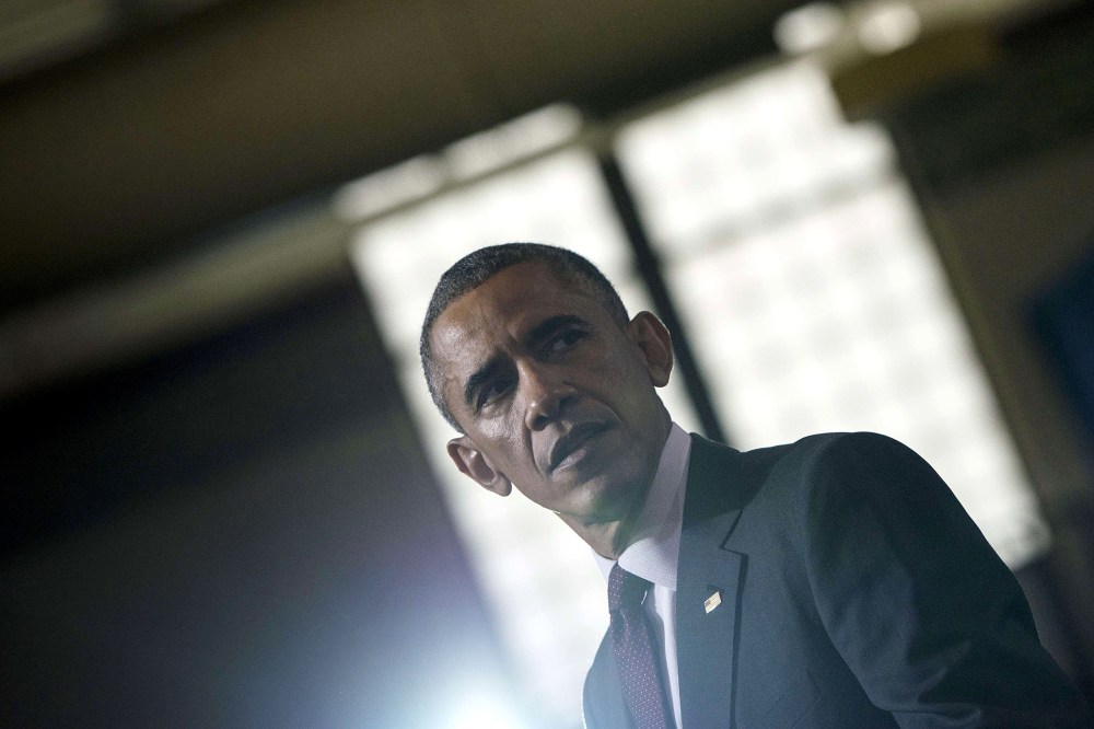 US President Barack Obama pauses while speaking at Rhode Island College Oct. 31, 2014 in Providence, Rhode Island.