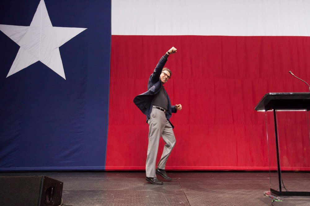 Gov. Rick Perry of Texas pumps a fist while taking the stage at an election night rally in Austin. (Photo by Michael Stravato/The New York Times/Redux)