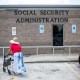 A woman walks to a Social Security office in Houston on July 13, 2022.