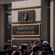 Members of the media cover a rally outside the Department of Veterans Affairs headquarters in Washington on Feb. 13, 2025.