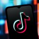 The TikTok logo displayed on a smartphone screen.