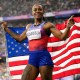 Sha'carri Richardson holds the U.S. flag.