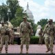 Members of the National Guard stand outside Union Station on Aug. 14, 2025 in Washington, D.C.