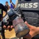 A journalist holds the blood-covered camera belonging to Palestinian photojournalist Mariam Dagga