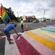 Activists rally at the Pulse Interim Memorial after repainting a rainbow-colored crosswalk on Friday, Aug. 22, 2025, in Orlando, Fla.