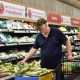 A man shops at supermarket.