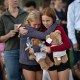 Two girls hug at a vigil on Aug. 27, 2025 for the victims of a shooting at Annunciation Catholic School  in Minneapolis