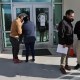 People arrive for appointments at U.S. Immigration and Customs Enforcement (ICE) in Chantilly, Virginia.