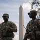 Members of the D.C. National Guard stand in front of the Washington Monument on Aug.17, 2025.