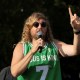 Sean Feucht raises his hand as he speaks.