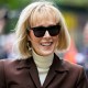 E. Jean Carroll smiles as she arrives at Manhattan federal court