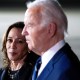 Kamala Harris, left, looks at Joe Biden as they stand next to each other