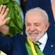Luiz Inacio Lula da Silva smiles as he waves