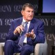 Joe Manchin speaks while seated on stage