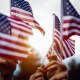 Group of people celebrating with national US flag.