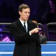 Jared Kushner points while standing