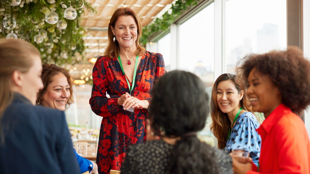 Senior businesswoman giving speech at business conference