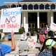Demonstrators approach the Legislative Building during a rally protesting a proposed election redistricting map on Tuesday.