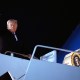 President Donald Trump boards Air Force One.