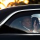 U.S. President Donald Trump waves from the Presidential limousine.