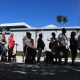 People waiting in line to receive groceries from Curley's House Food Bank.