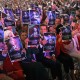 Attendees hold posters of late right-wing activist Charlie Kirk during a Turning Point USA.