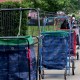 Carts lined up to reserve people’s places in line for meals.