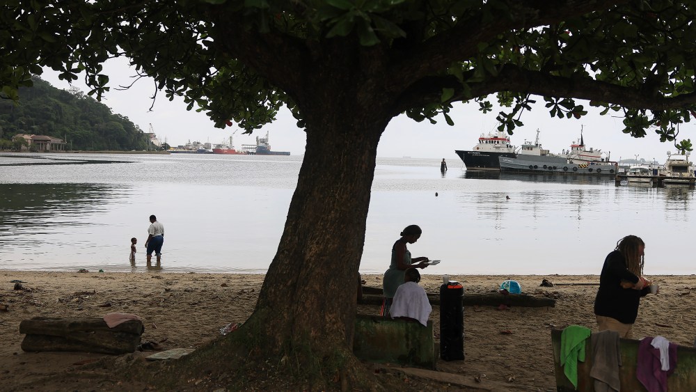 People along the Gulf of Paria in Port of Spain, Trinidad and Tobago.