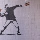 Banksy-style posters depicting a man throwing a sandwich in Washington, D.C.