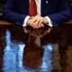 View of Donald Trump's hands on his desk in the Oval Office of the White House.