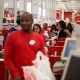 Employees ring customers up at cash registers inside a Target store in Jersey City, N.J.