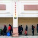 Furloughed federal workers wait in line at a Capital Area Food Bank distribution site.