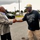 Calvin Duncan, left, shakes hands with exoneree Raymond Flanks in New Orleans.