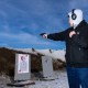 A person practices shooting at a concealed carry permit class in Rexburg, I.D.