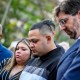 Kilmar Abrego Garcia (C), Rep. Glenn Ivey (L), Garcia's wife Jennifer Vasquez Sura (2nd-L), and his lawyer Simon Sandoval-Moshenberg (R) participates in a prayer vigil for him before he enters a U.S. Immigration and Customs Enforcement (ICE) field office.