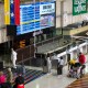 Travelers wait in line to check in for flights at the Simón Bolívar International Airport in Venezuela.