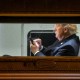 US President Donald Trump uses a cellphone aboard Marine One.