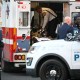 An unidentified man in military fatigues lies on a stretcher inside an ambulance in downtown Washington, D.C.